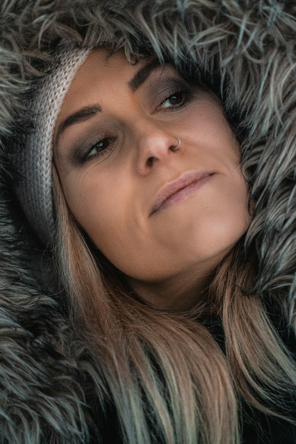 woman in gray fur hoodie
