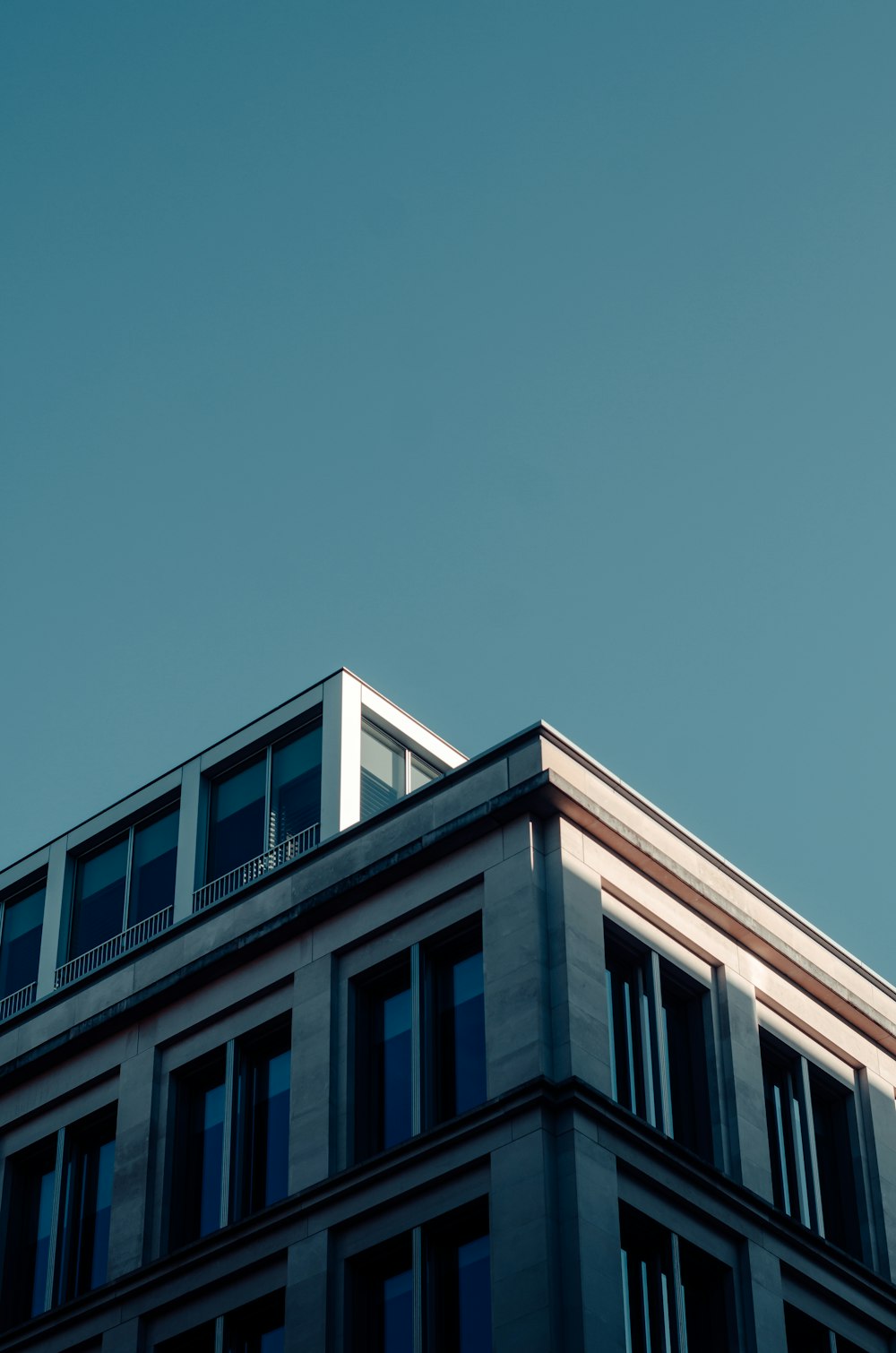 white concrete building under blue sky during daytime