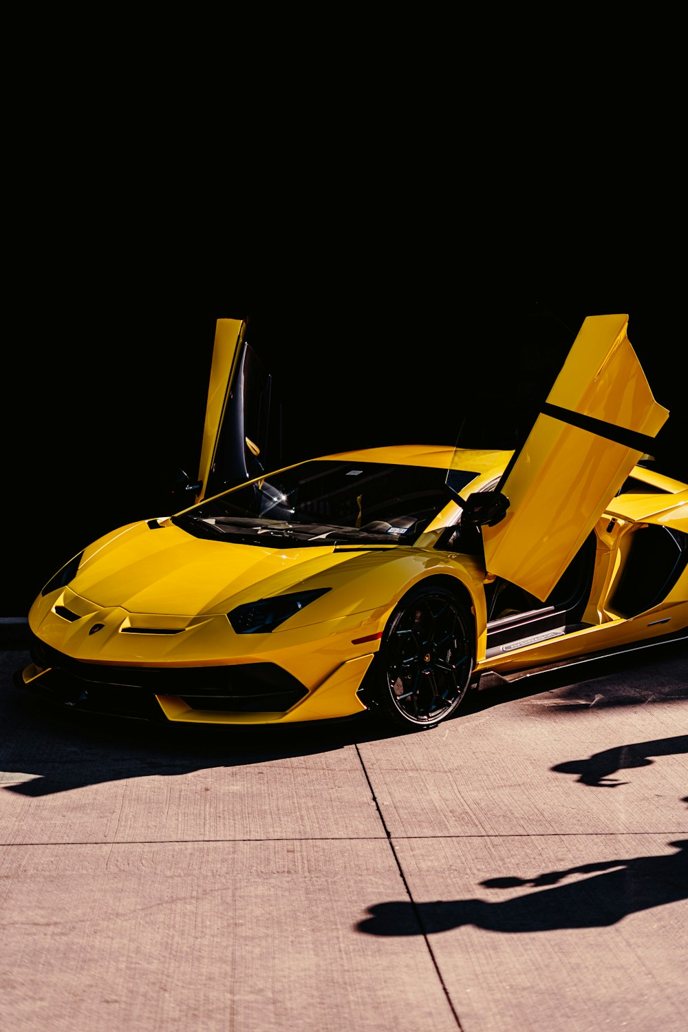 yellow ferrari 458 italia on black background