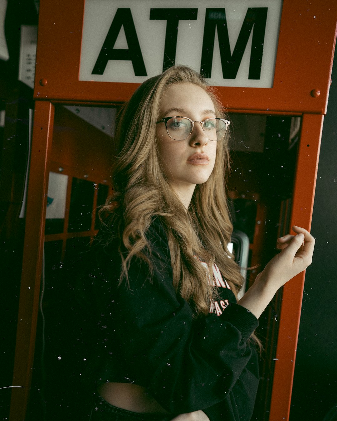 woman in black jacket wearing eyeglasses