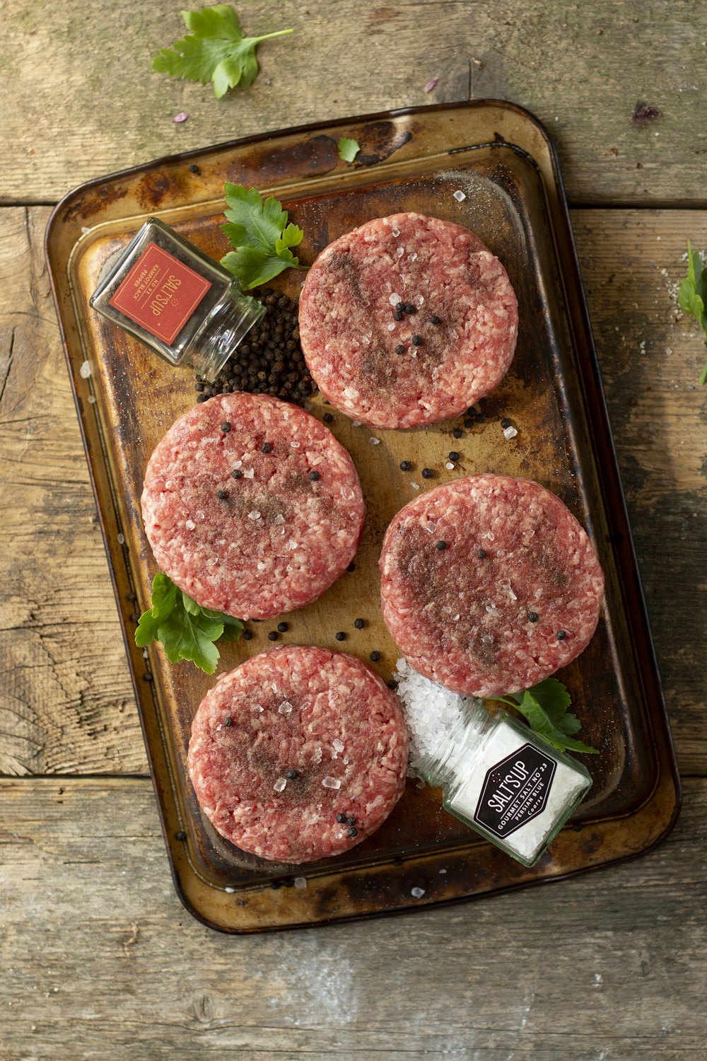 raw meat on brown wooden chopping board