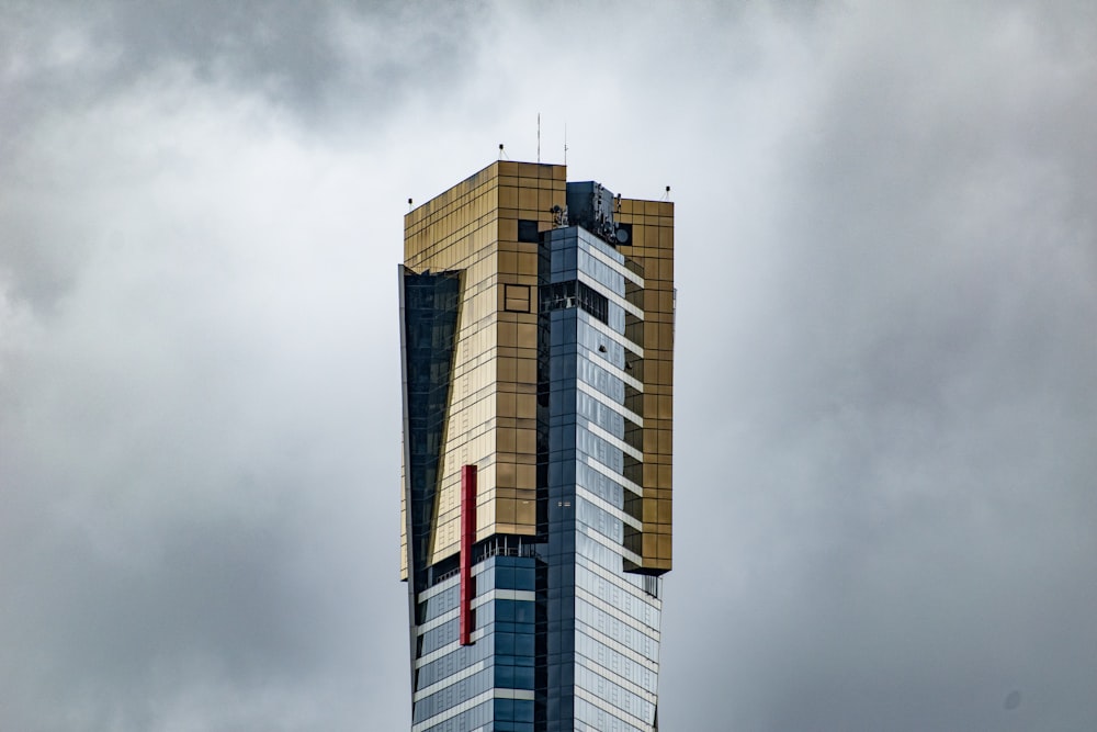 white and brown concrete building under gray sky