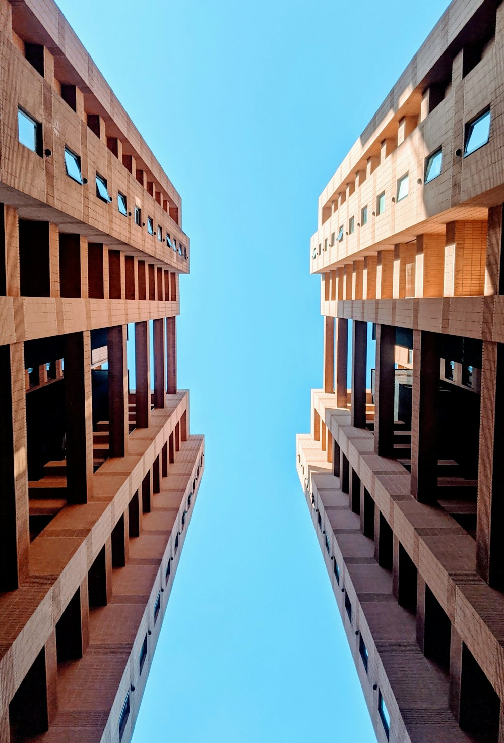 brown concrete building under blue sky during daytime