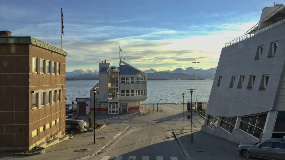 red and white building near body of water during daytime