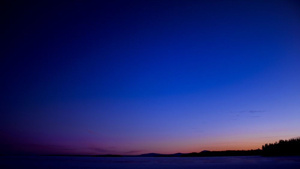 silhouette of mountain during sunset