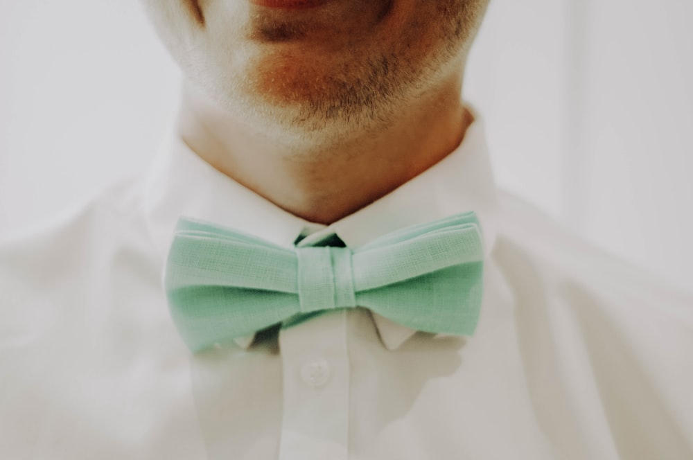 man in white dress shirt with black bowtie