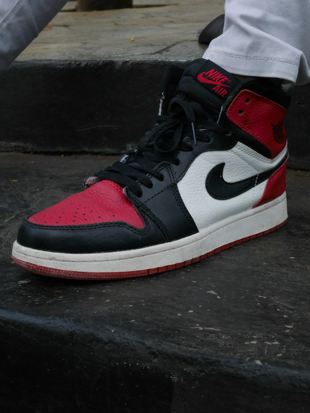 black white and red nike air jordan 1 shoe photo – Free Brown Image on  Unsplash