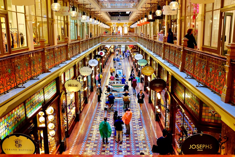 people walking on hallway inside building