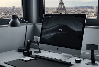A minimalist Parisian office with a team collaborating remotely via video call.