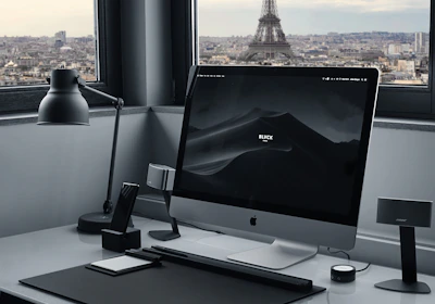 A minimalist Parisian office with a team collaborating remotely via video call.