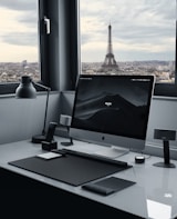 silver imac on white table