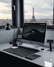 A minimalist Parisian office with a team collaborating remotely via video call.