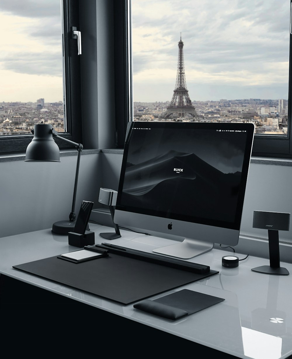 silver imac on white table