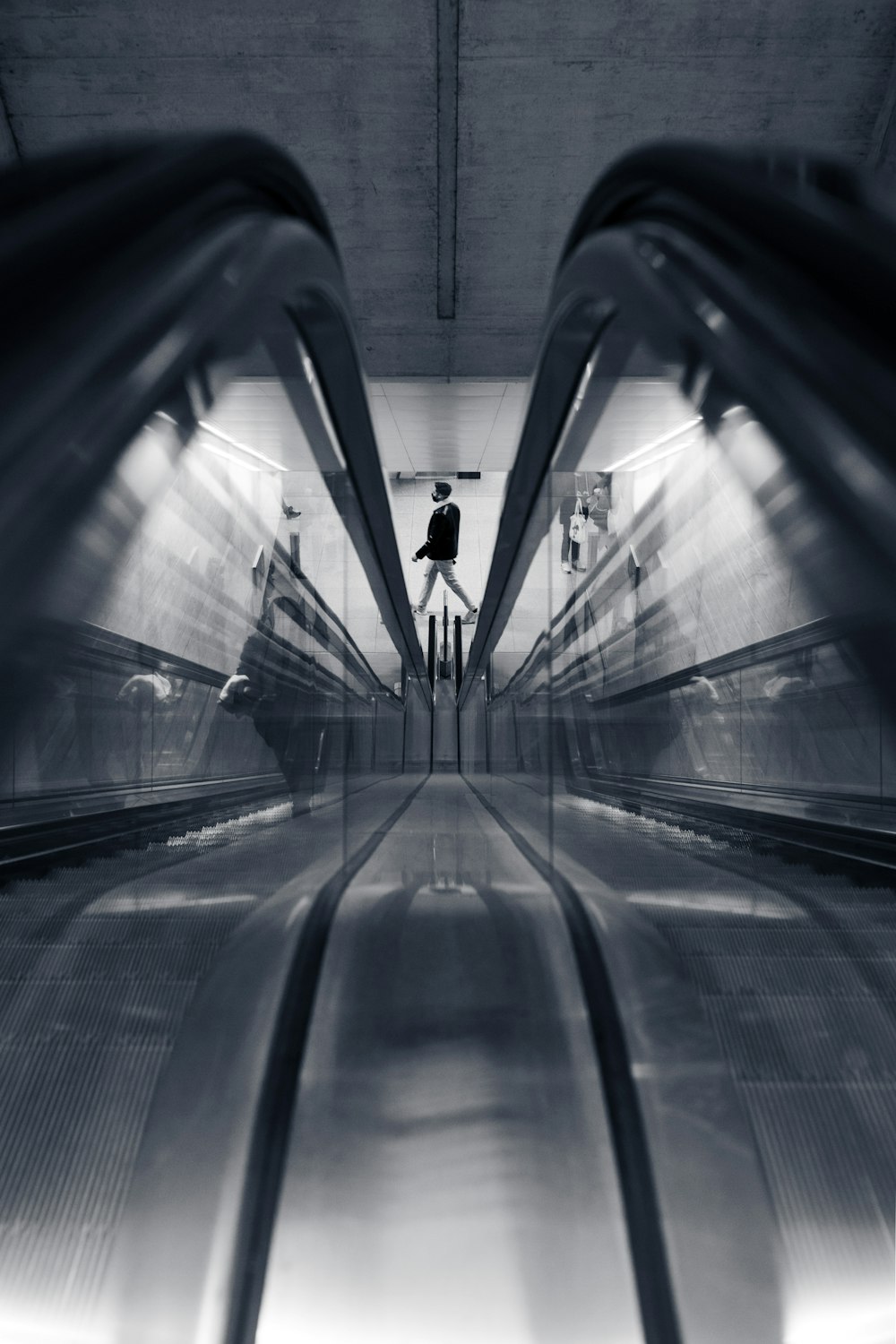 person walking on tunnel during daytime