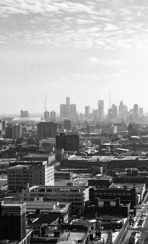 grayscale photo of city buildings