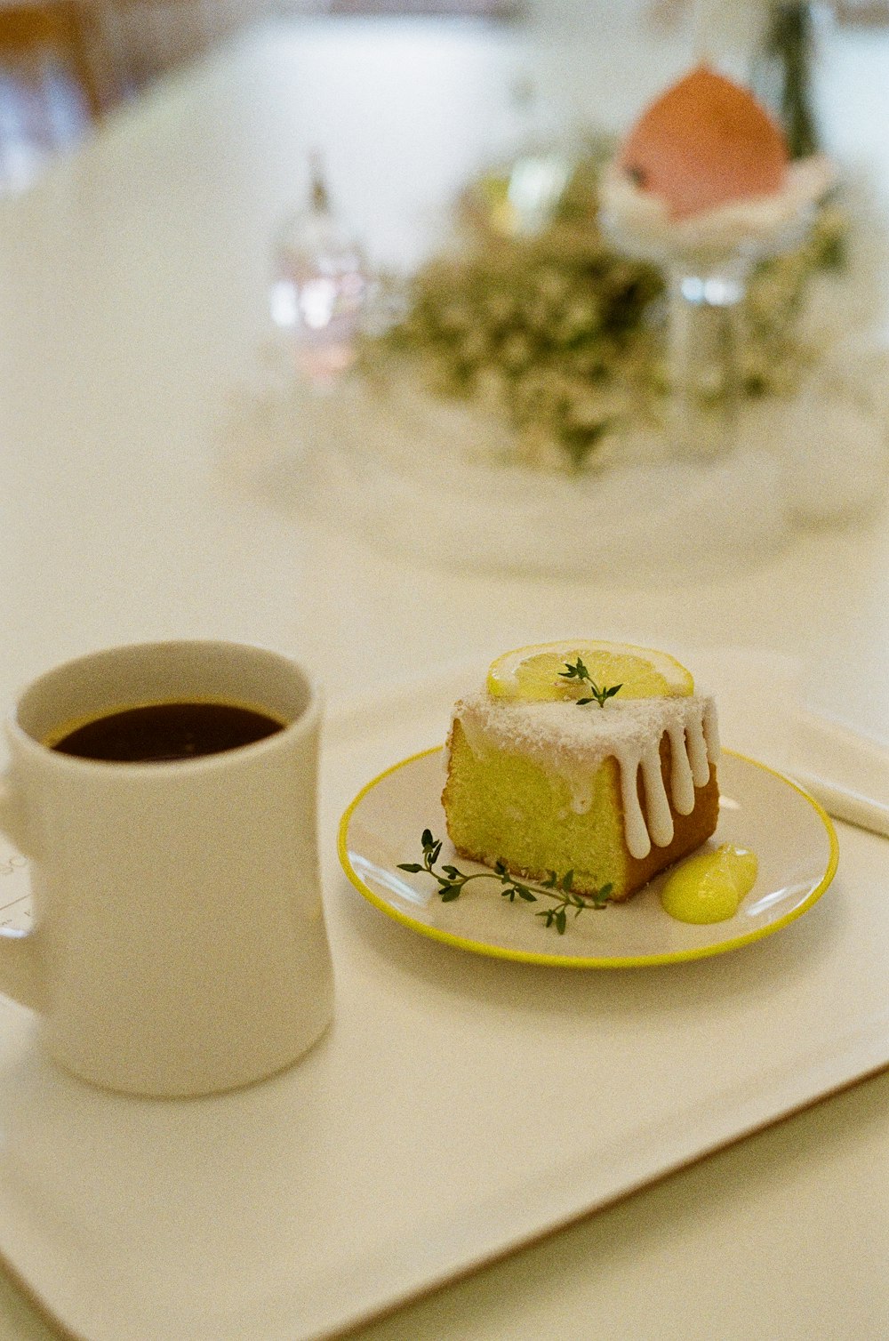 white ceramic mug on white ceramic plate