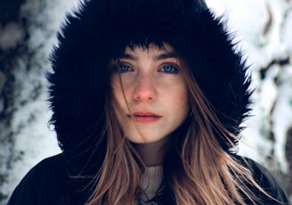 woman in black hat and black coat