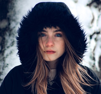 woman in black hat and black coat