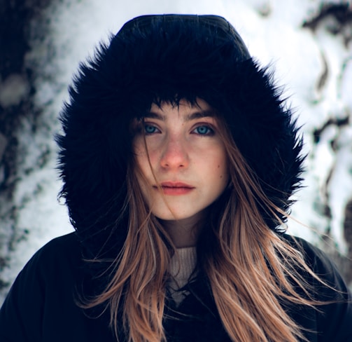 woman in black hat and black coat