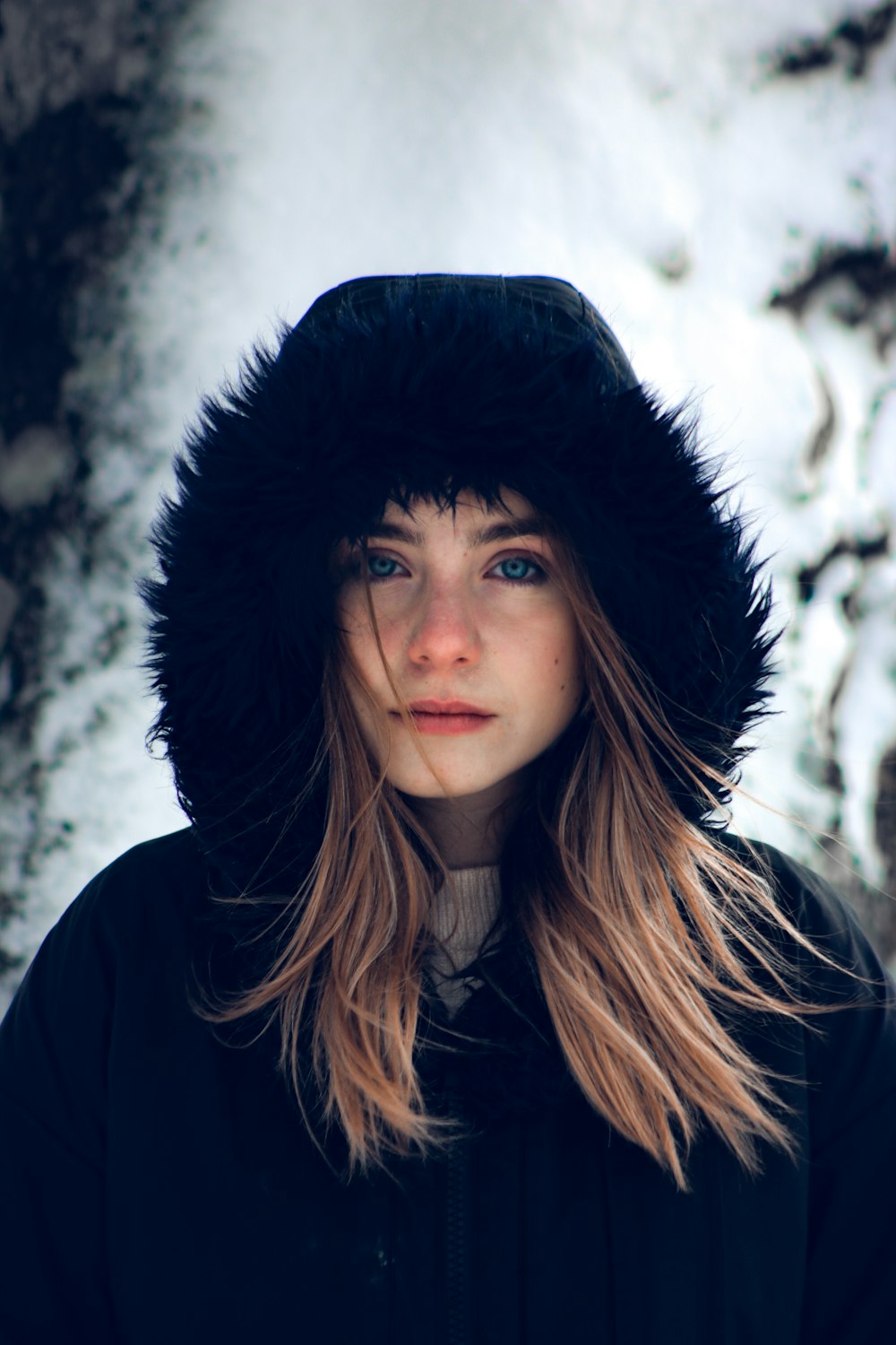 woman in black hat and black coat