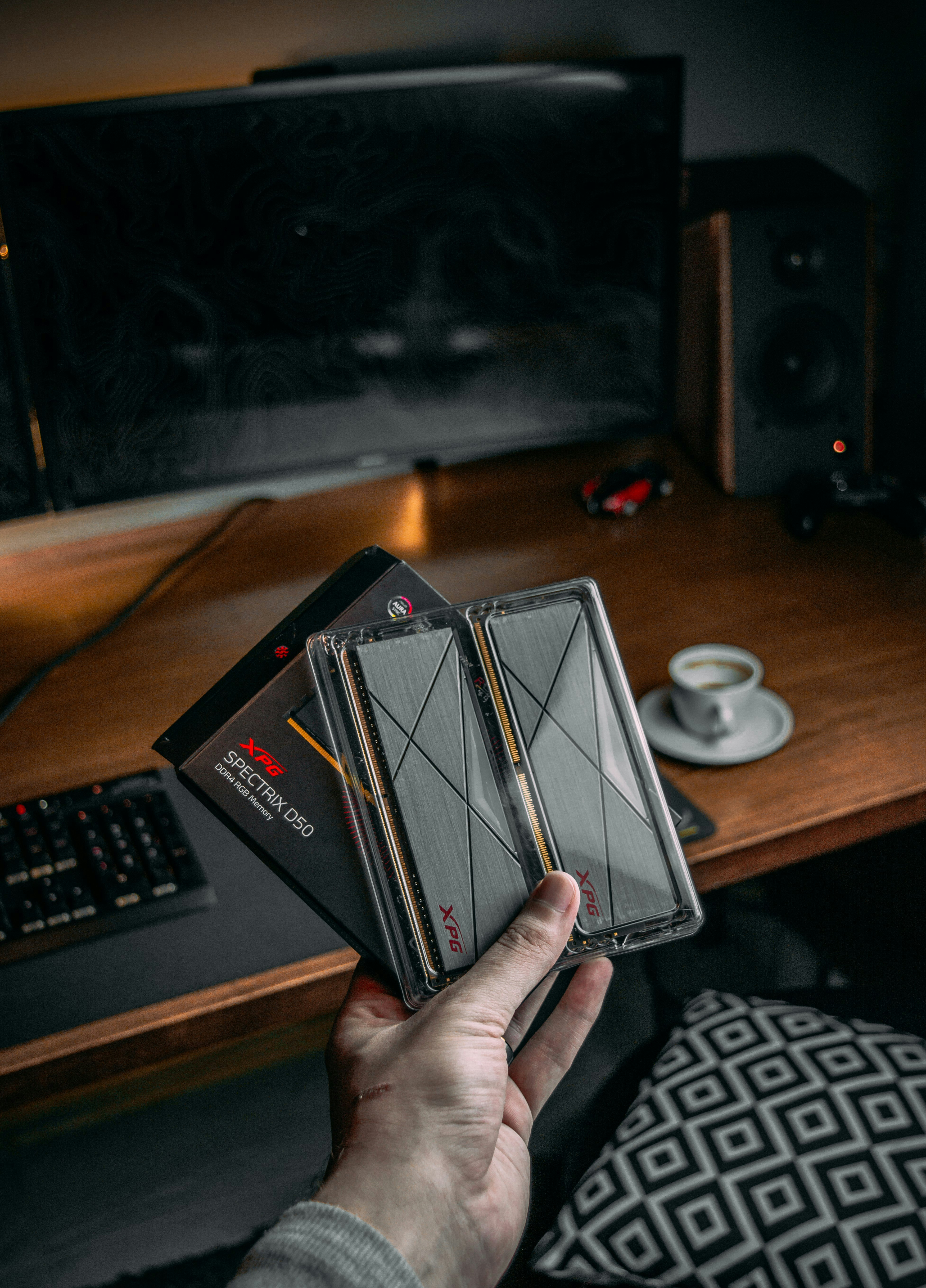 person holding black and white box