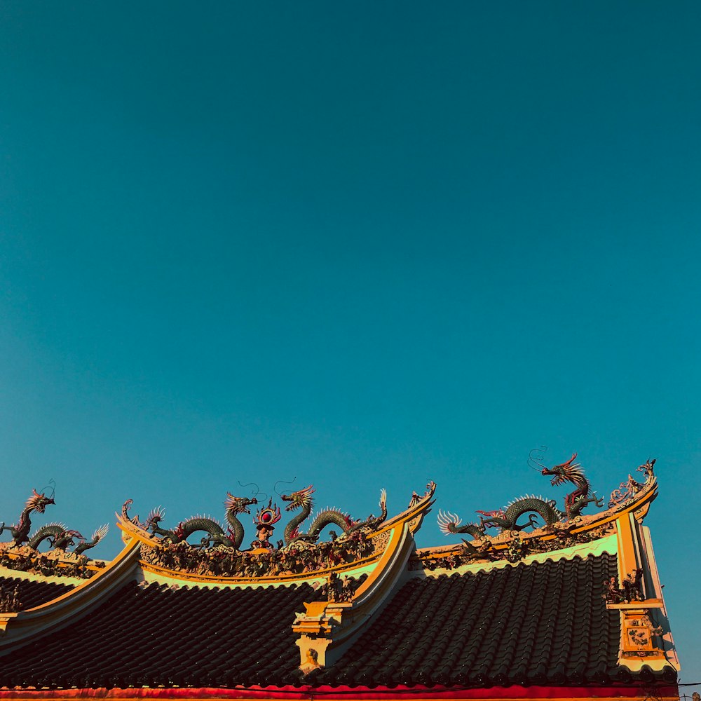 red and gold temple under blue sky during daytime