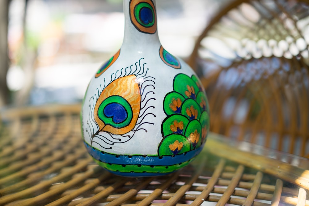 white blue and yellow ceramic bird figurine