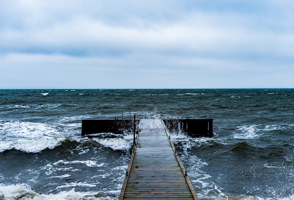 brown wooden dock on sea during daytime