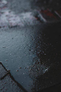 water droplets on black surface