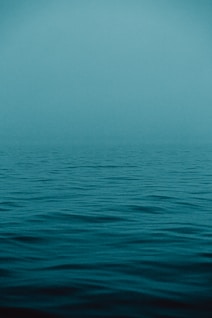 blue sea under blue sky during daytime