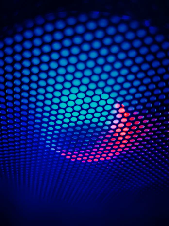 Abstract futuristic grid in black and white with piercing electric blue bursts.