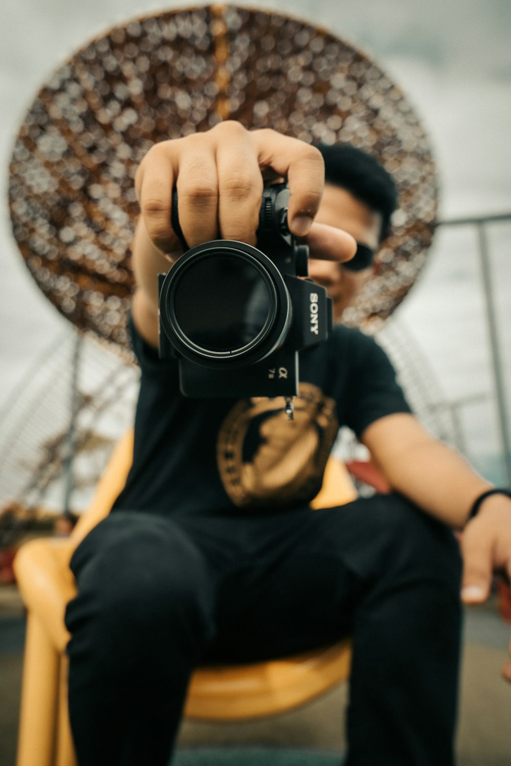 person holding black dslr camera