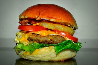 A delicious beef burger topped with fresh ingredients.