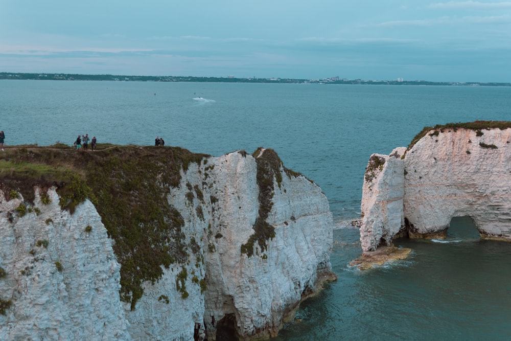 brown rock formation on sea during daytime