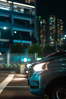 Nighttime cityscape of Tampa with a Ford Focus illuminated by streetlights.