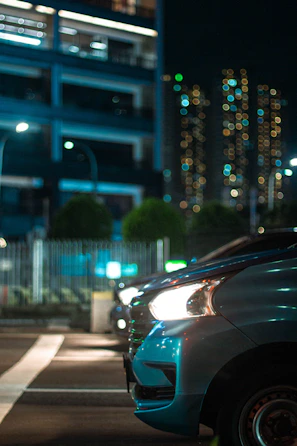 Nighttime cityscape of Tampa with a Ford Focus illuminated by streetlights.