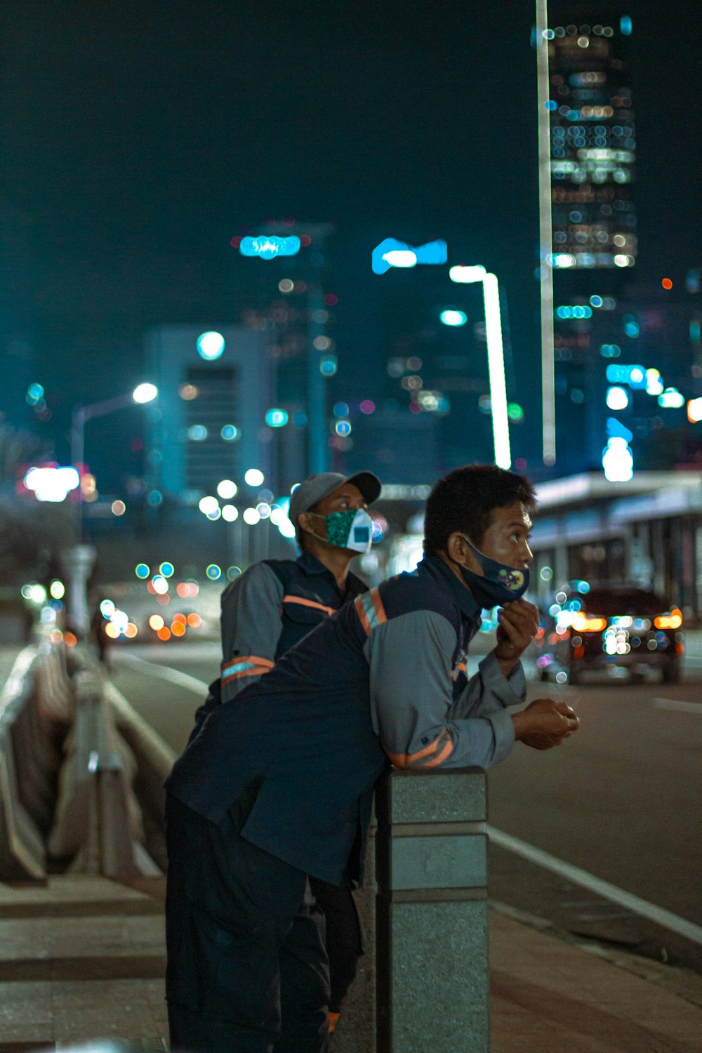 man in black jacket carrying child in white jacket