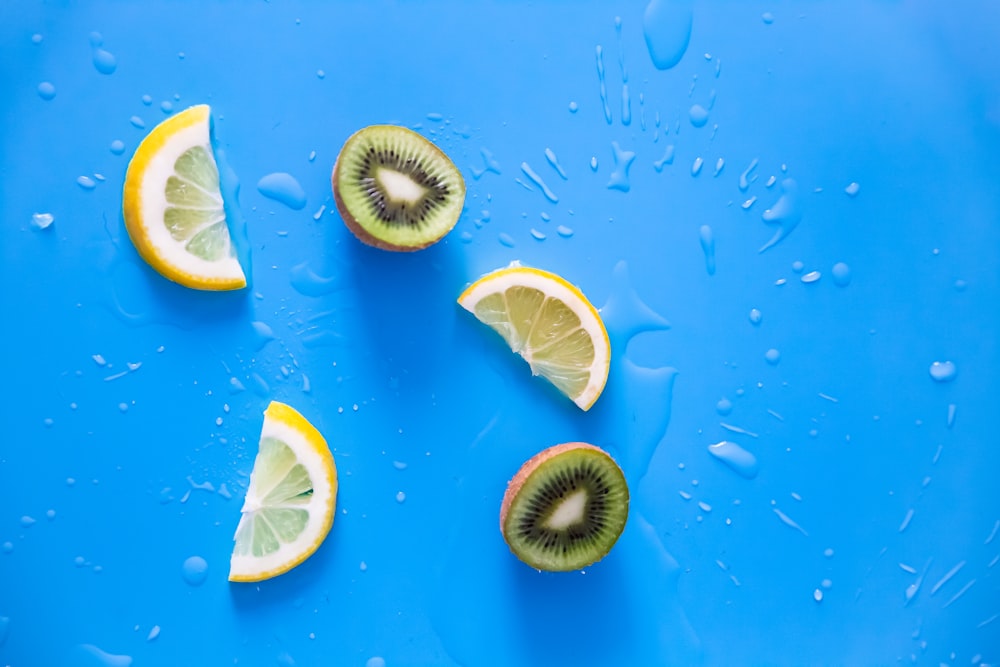 sliced lemon on blue surface