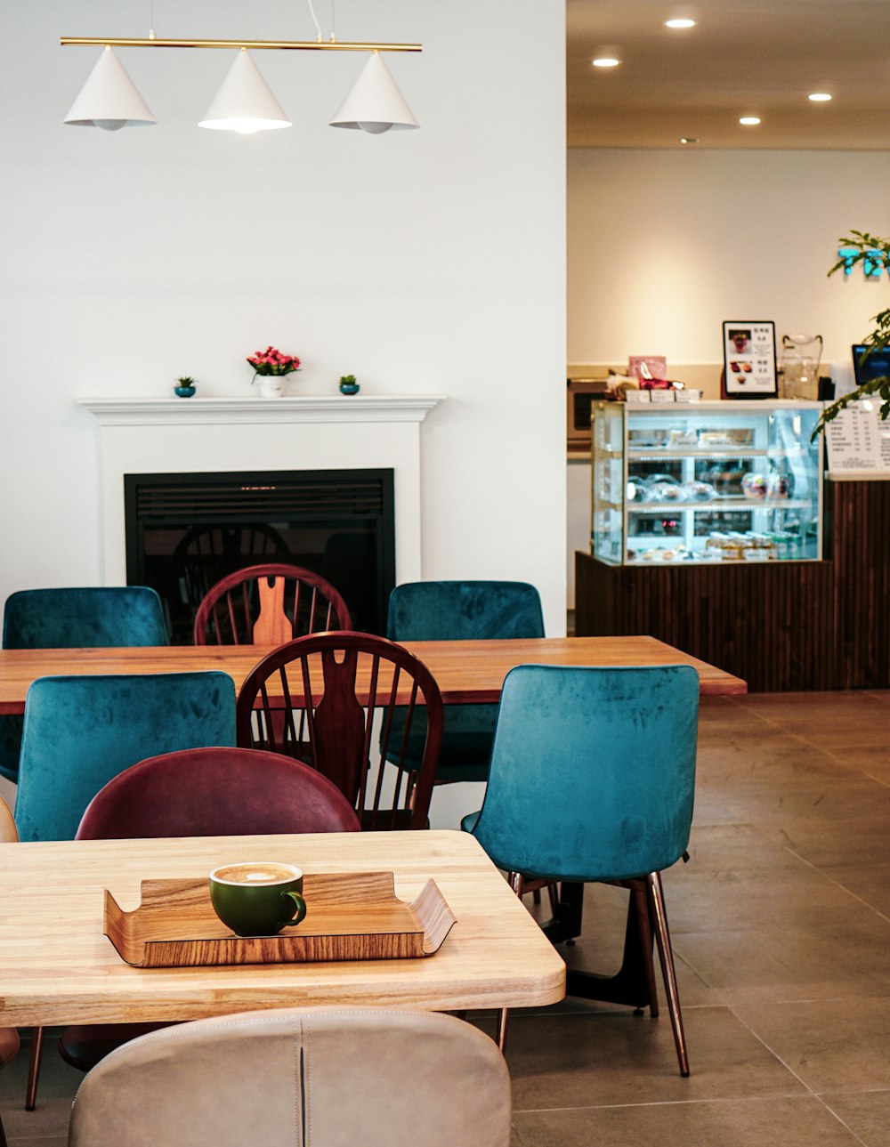 blue and black chair near brown wooden table