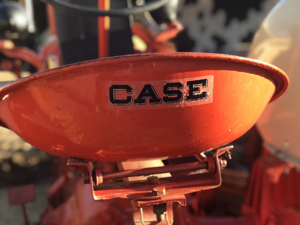 a close up of a case logo on a red fire hydrant