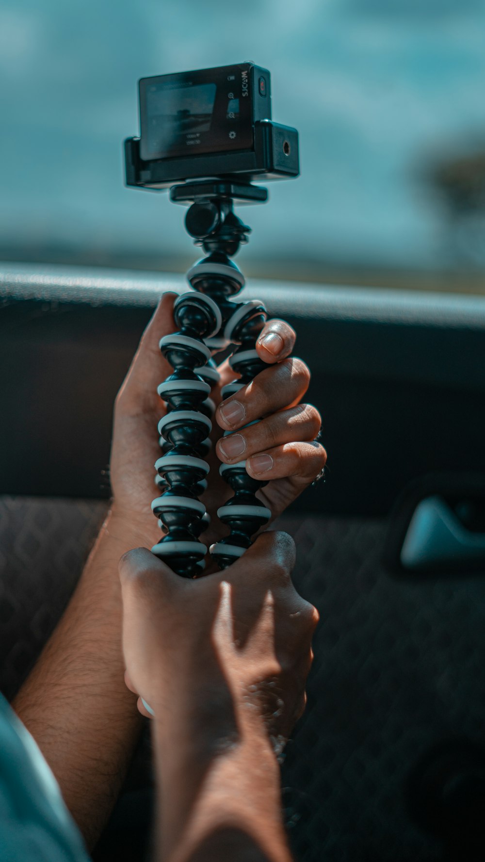 person holding black metal tool