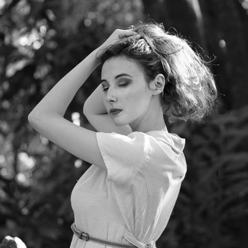 grayscale photo of woman in white shirt