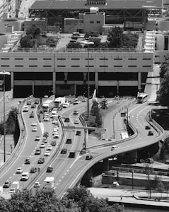 grayscale photo of cars on road