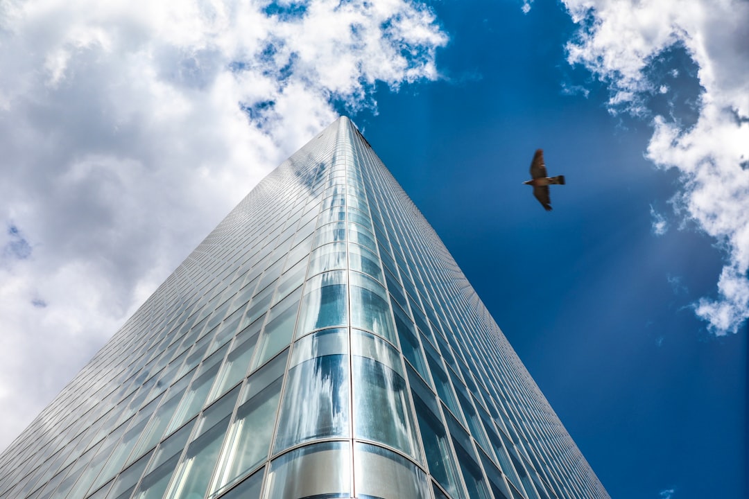 low angle photography of high rise building under blue sky during daytime