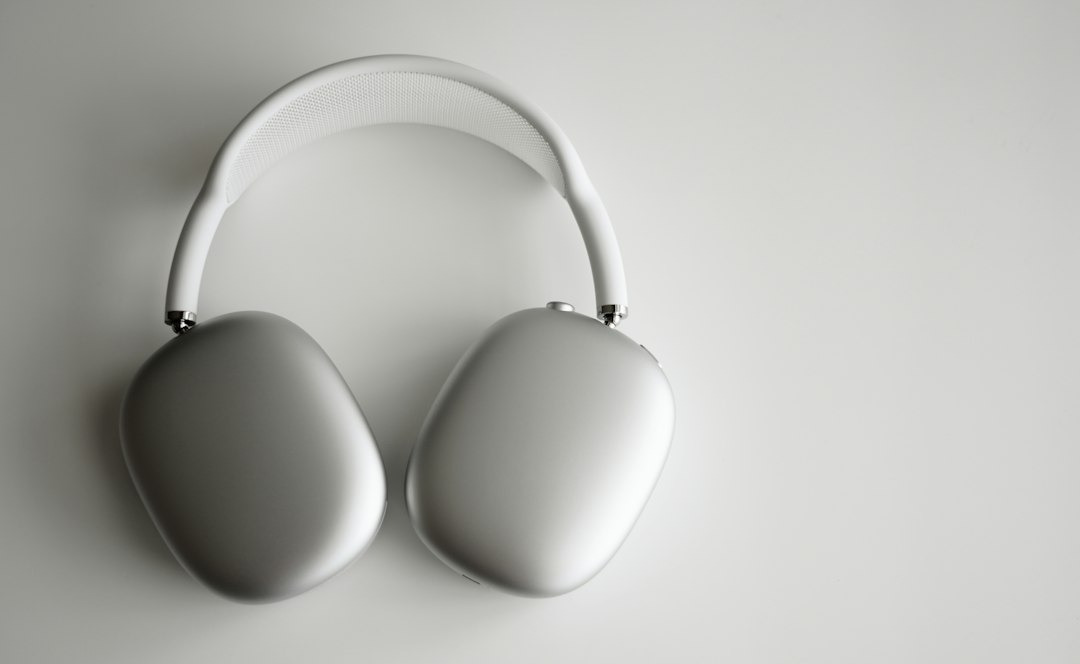 white wireless headphones on white table, AirPods Max — a perfect balance of exhilarating high-fidelity audio and the ef