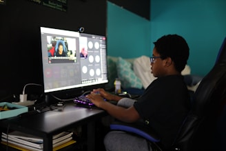 man in black shirt using computer