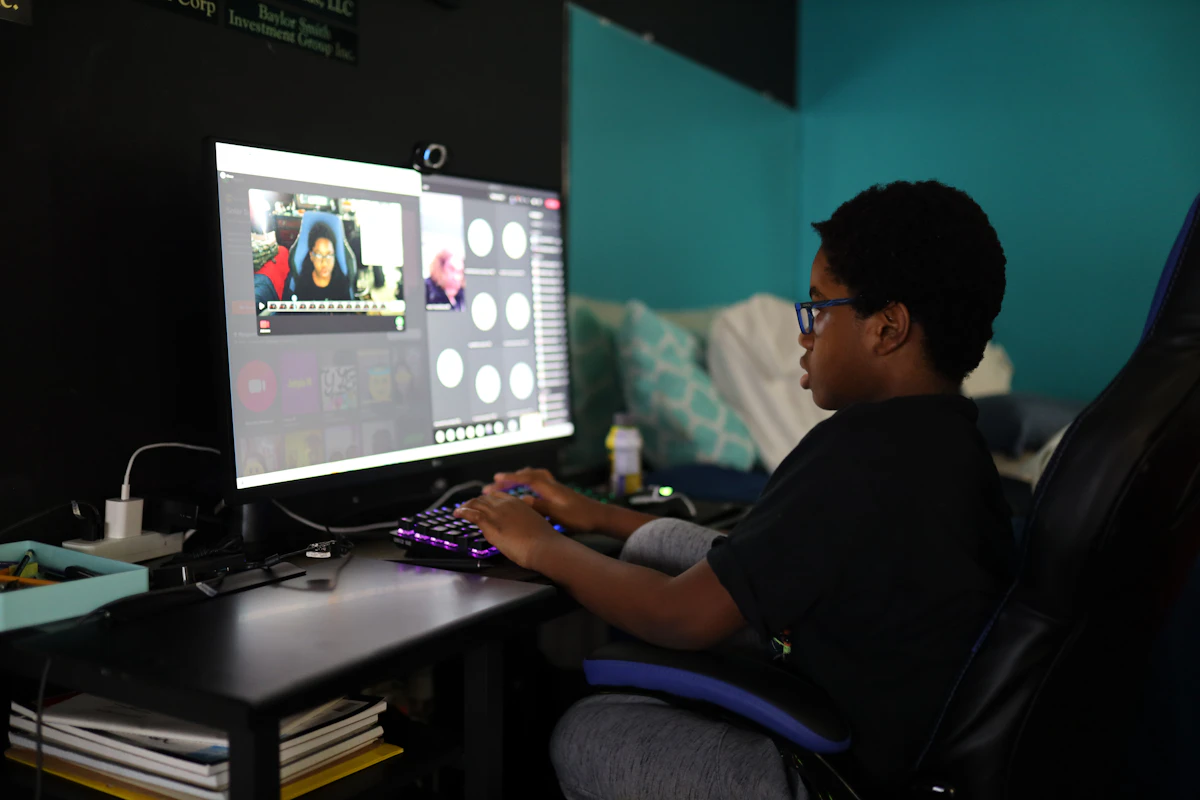 Man in black shirt using computer