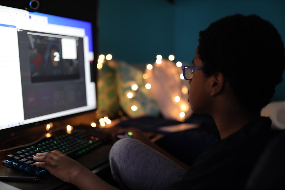 man in black shirt using computer,