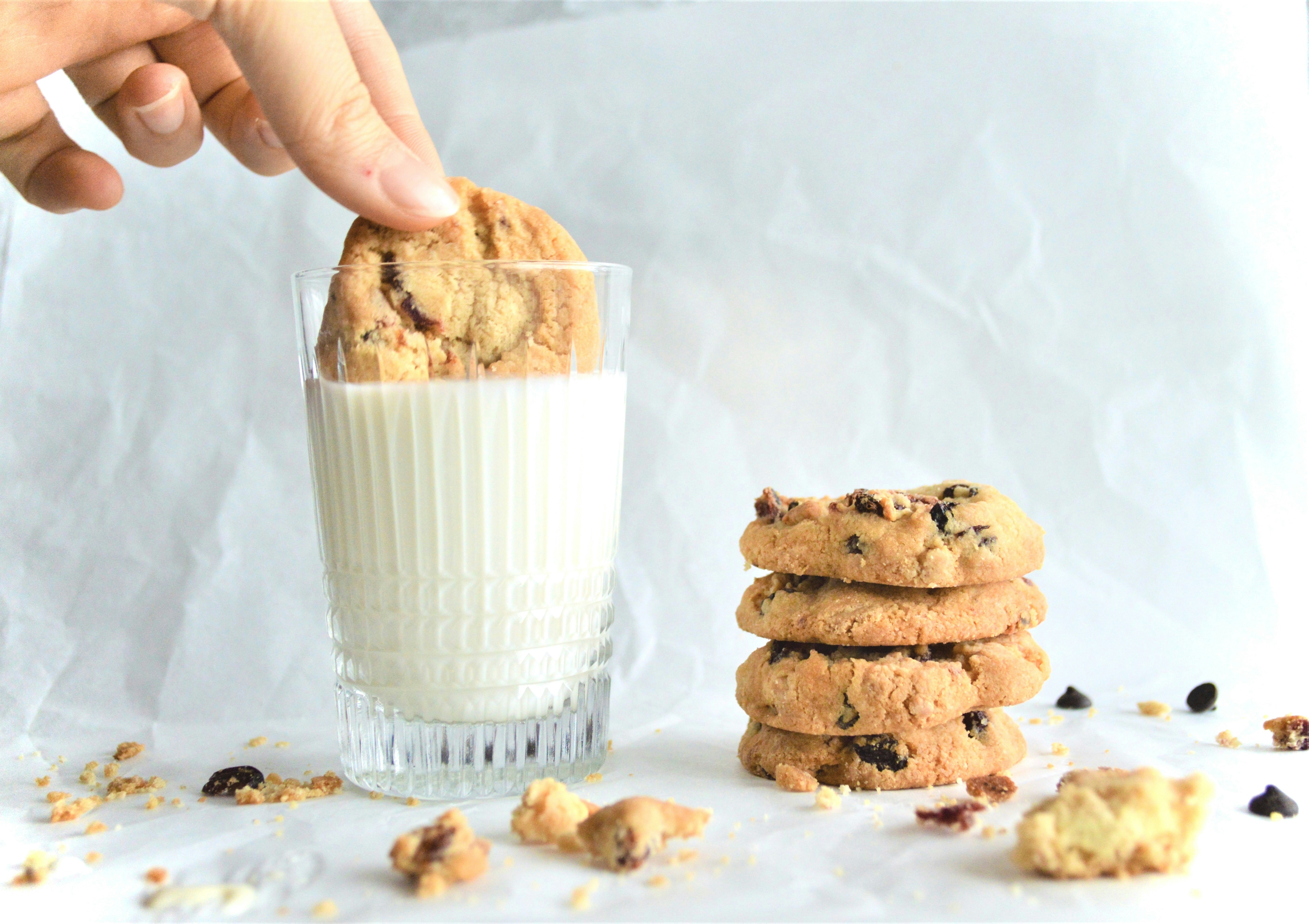 person holding clear glass cup with brown liquid, Chocolate cookie and milk | Check out my insta profile @rumeyysaben