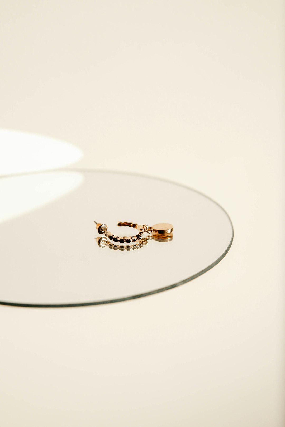 gold and diamond ring on white surface